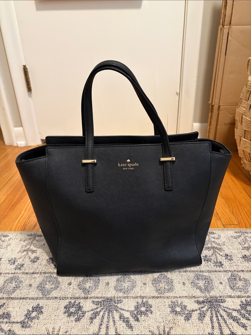kate spade black leather tote with gold-tone logo